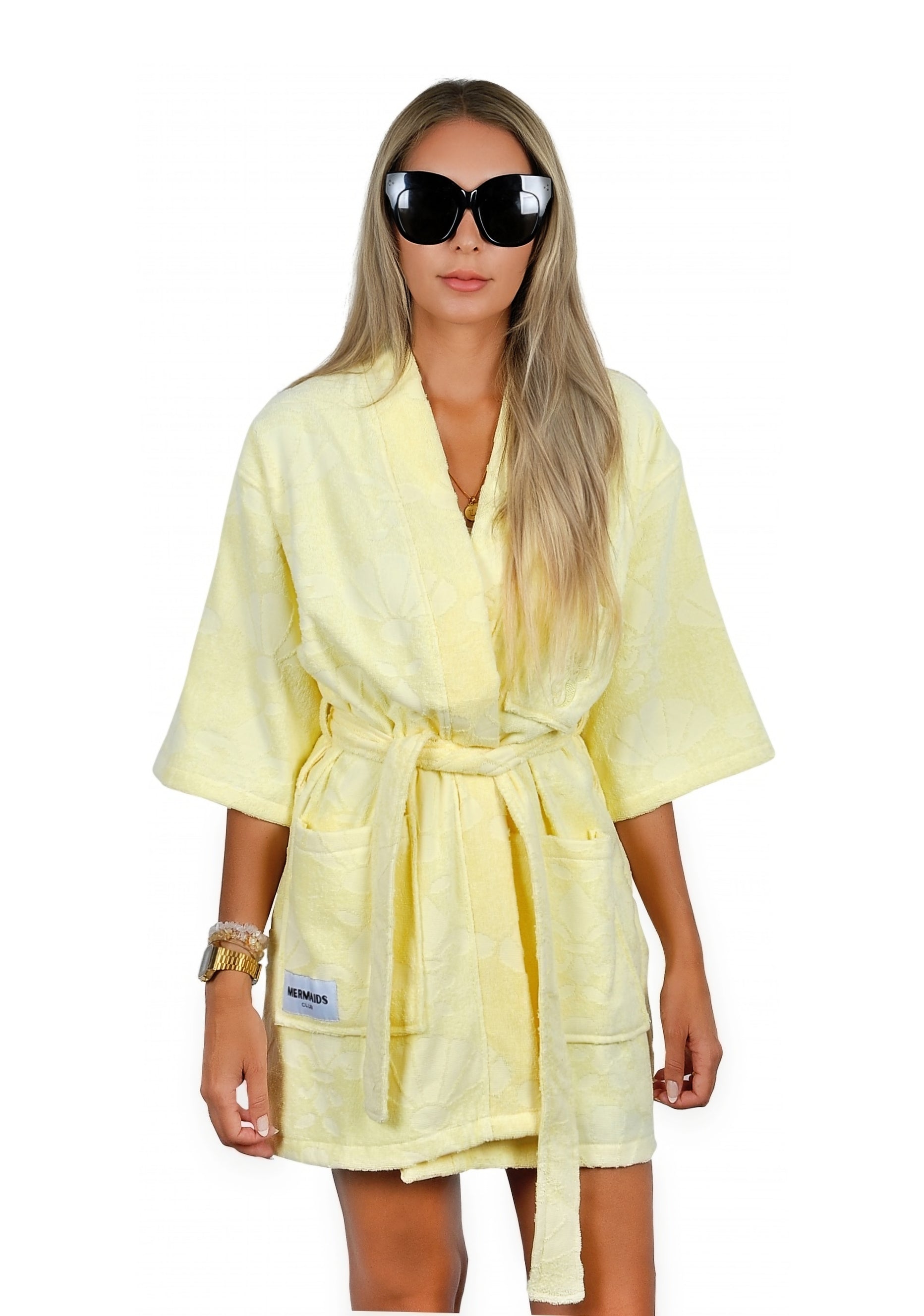 Woman wearing yellow V-neck beach robe poolside UAE — Mermaids Club