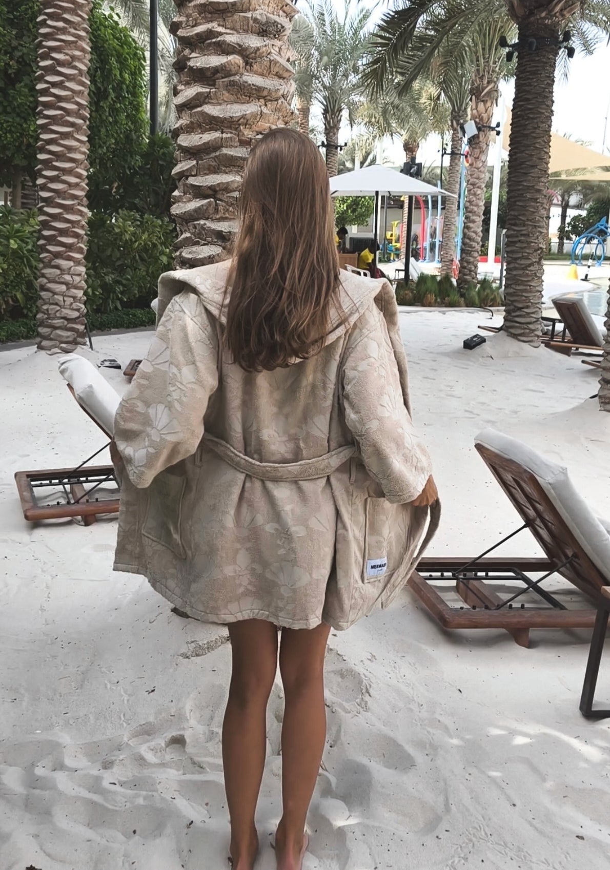 Women wearing a stay-in-place beach robe designed for post-swim comfort in Palm Jumeirah Dubai - Mermaids Club